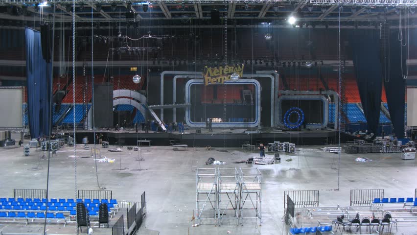 MOSCOW - DEC 17: (Timelapse View) Sceneshifters dismantle inscription with concert title, concert of Legend RetroFM in Sports complex Olimpiyskiy, on Dec 17, 2011 in Moscow, Russia 