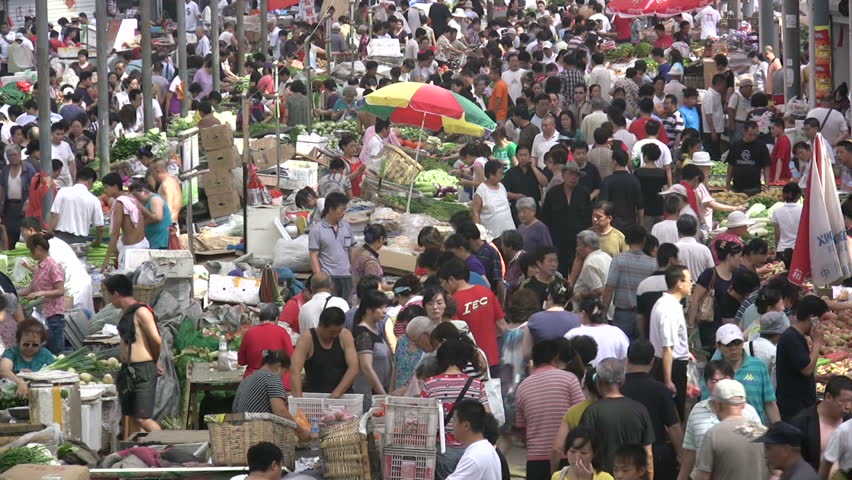 QINGDAO - JUNE 25: People are busy shopping for fruit and vegetables on June 25, 2010 in Qingdao, China.