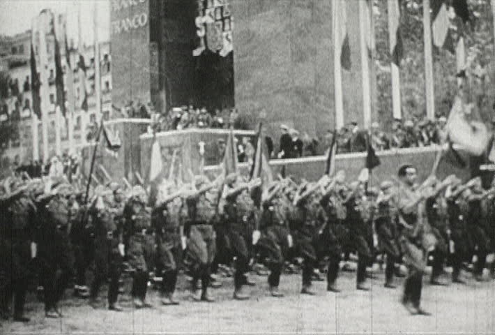 EUROPE - CIRCA 1942-1944: World War II, Hitler and Soldiers March Through Town