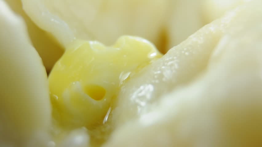Fresh piece of butter melting in hot ravioli. Part 2.