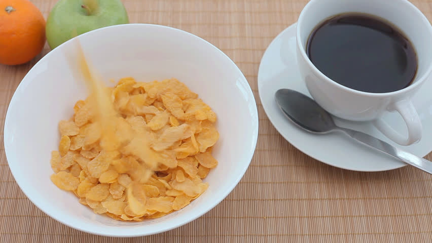 Cornflakes pouring in to a bowl
