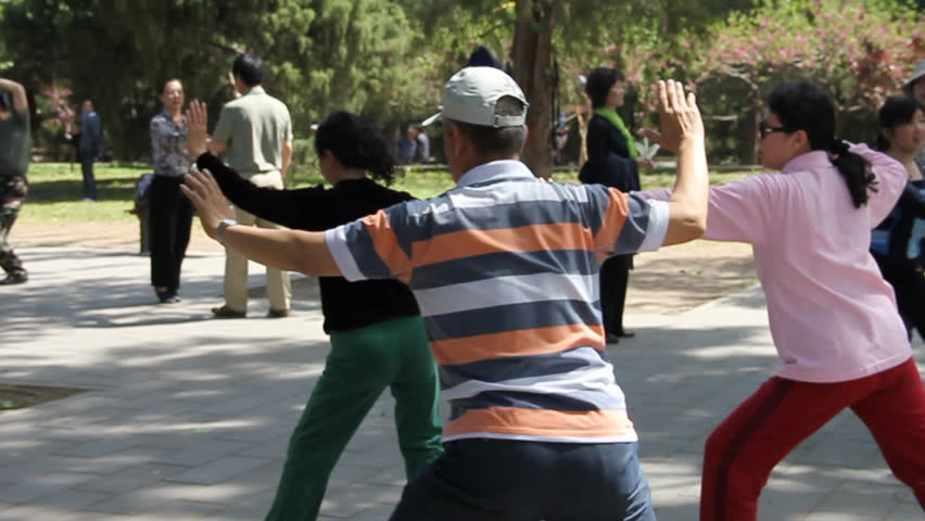 CHINA, BEIJING - MAY 2: (Slow motion view) People practicing Tai chi chuan in Beijing, China, on May 2, 2011. It is a type of internal Chinese martial art practiced for both its defense training and its health benefits.