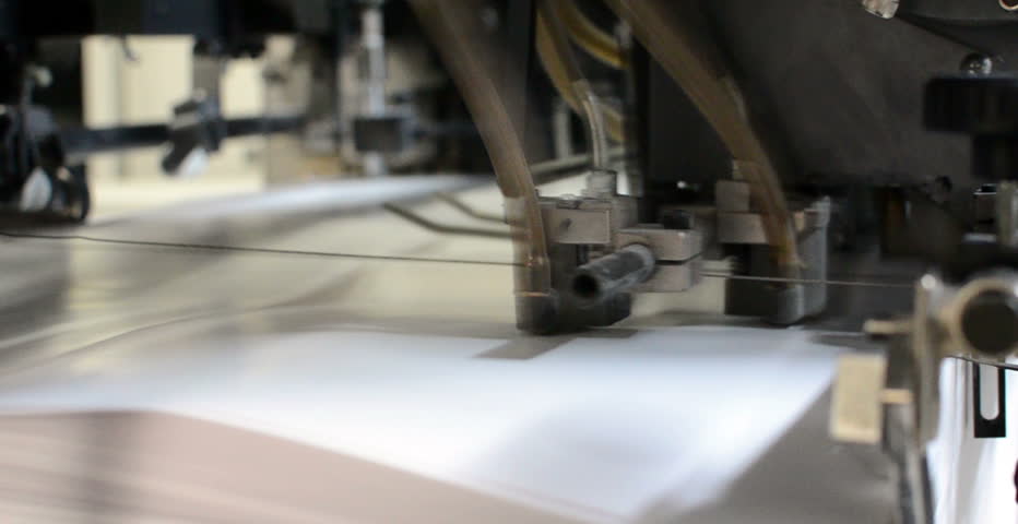 paper inserting into a printing press to be printed