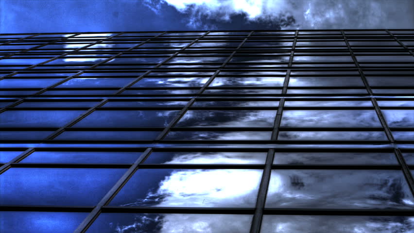 Clouds reflected in office building windows