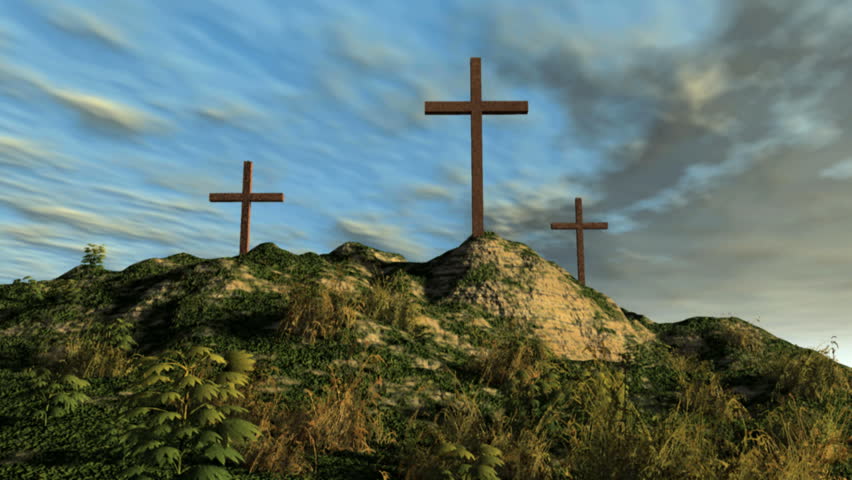 Camera moves up hill toward 3 Christian crosses on mountain.