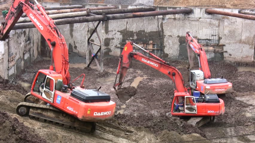 three excavators
