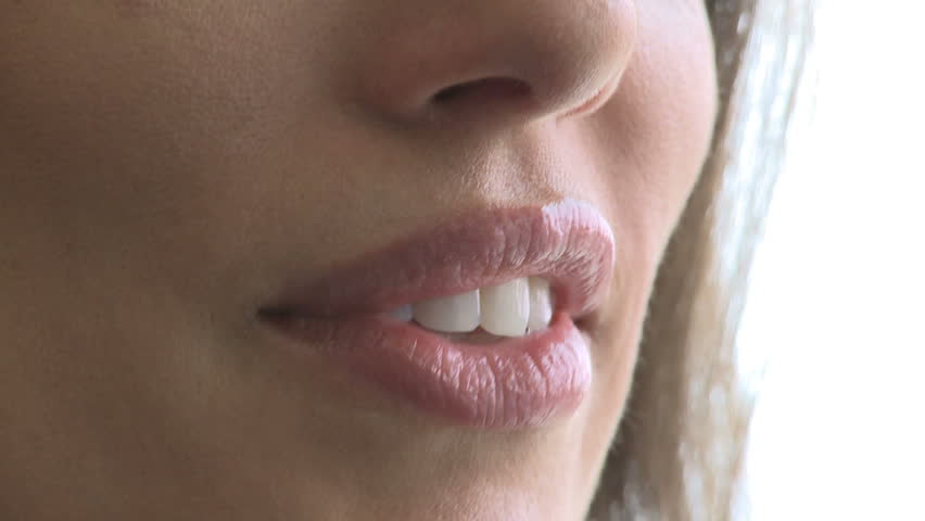 Closeup of woman's mouth as she converses (2 of 3)