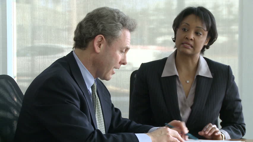Co-workers discuss presentation (1 of 7)