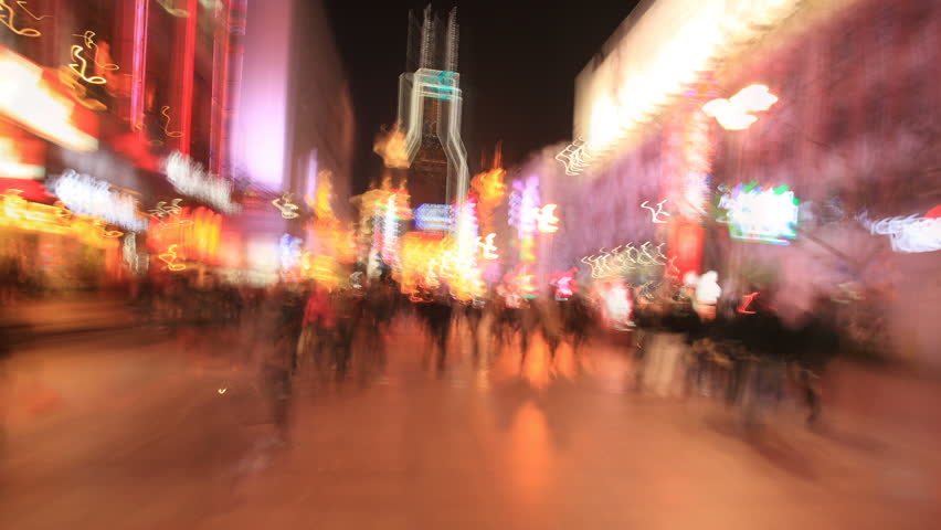 Walking Through Nanjing Road in Shanghai, Time lapse. Handheld slow motion shot.