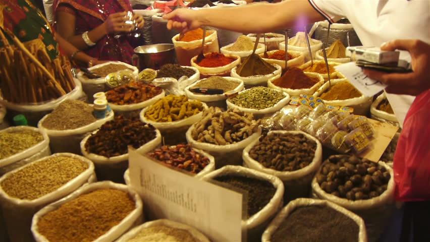 Spices lined in a row in an east asian market 