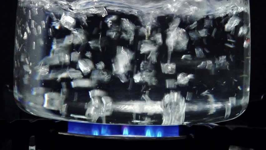 Peeled prawns falling into boiling water