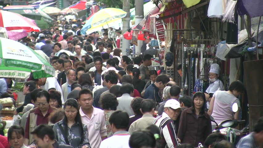 SHANGHAI - JUNE 2: People are shopping for groceries and household items at an outdoor market in Shanghai, China on June 2, 2010.