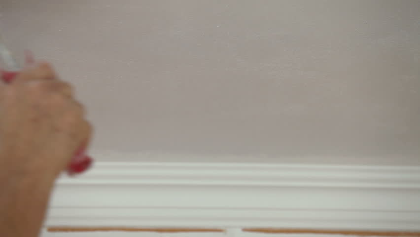 painting the ceiling, using a paint roller