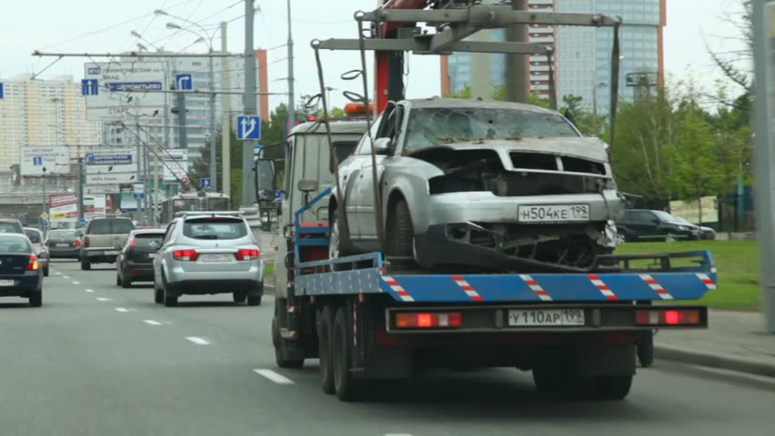 MOSCOW - MAY 15: Wrecker tows car in alarm status on highway, on May 15, 2011 in Moscow, Russia
