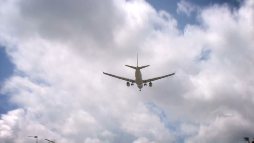 Aircraft 01, HD Passenger airplane on landing approach across a cloudy sky.