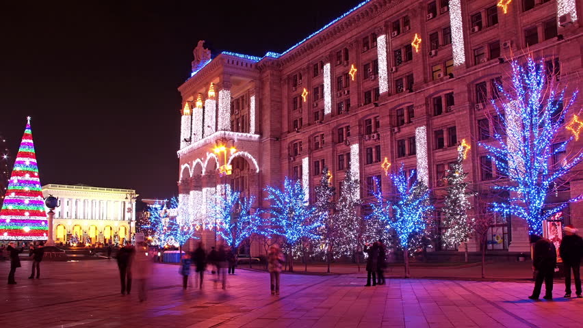 Time lapse of people walking through a square in Kiev at night during New Year's day