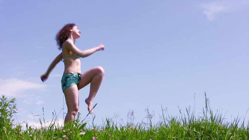 Marching woman on grass 
