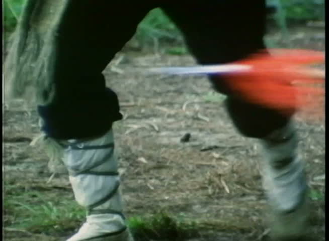 Medium shot of man dodging spear attack