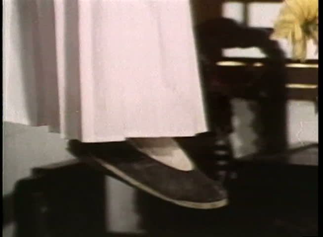 Close-up of Chinese slippers and robe of hanging person