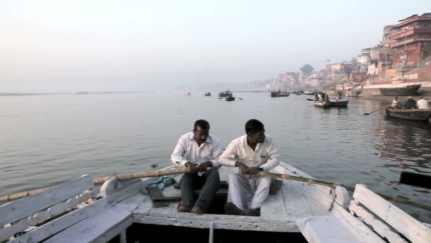 VARANASI-FEBRUARY 22: Indian people, row the boat along the Ganges for the city sightseeing tour on February 22, 2012 Uttar Pradesh, Varanasi India.