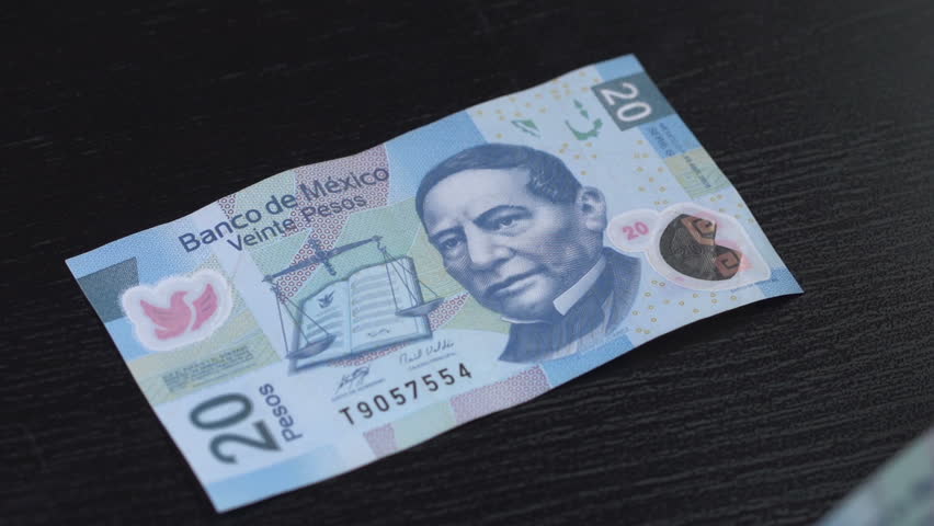 Mexican Pesos counted on a table