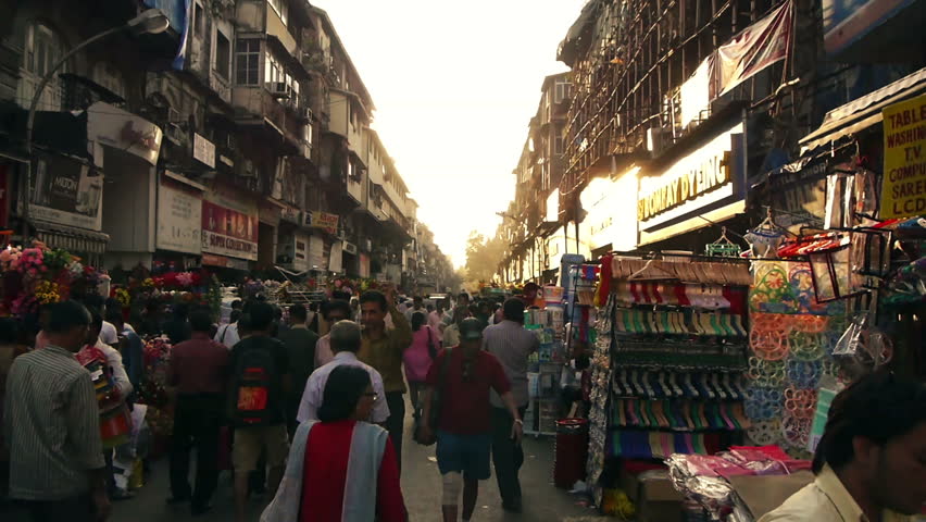 MUMBAI, INDIA - FEB 3: Indian street with a lot of pedestrians, taxis, cars, February 15, 2012 in Mumbai, India.