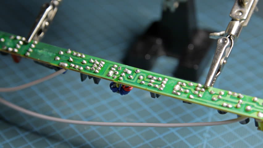 repairman with soldering iron 1/2