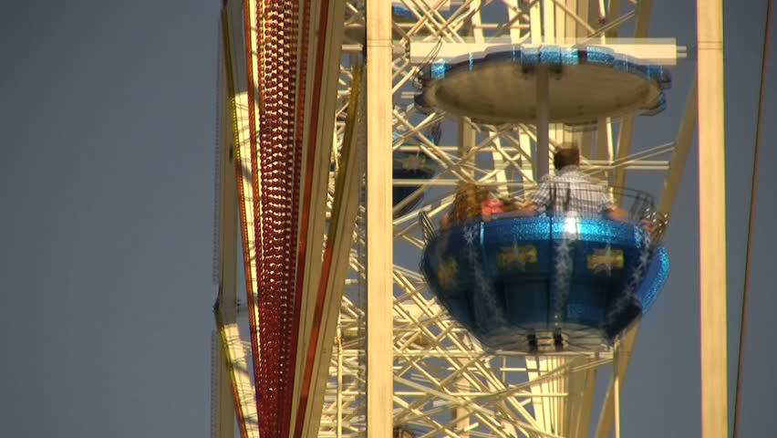 HAMBURG - MAY 8: Visitors in a giant wheel at the 822. anniversary of the Port of Hamburg on May 8, 2011 in Hamburg, Germany. Hafengeburtstag with more than 1.5 million visits & 300 ships.