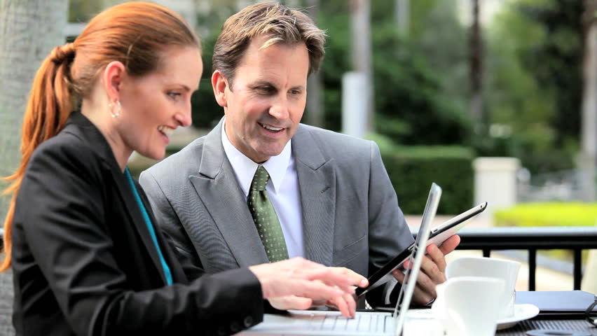 Business colleagues using a wireless tablet 