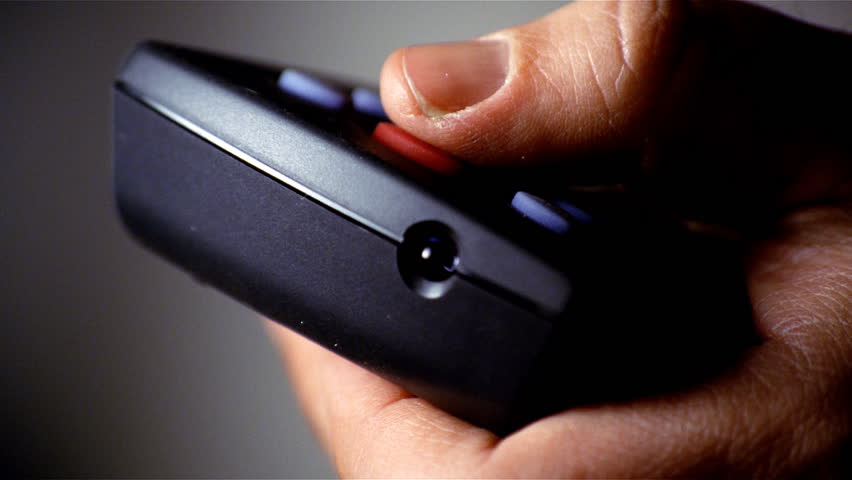 Hand pressing power on remote control