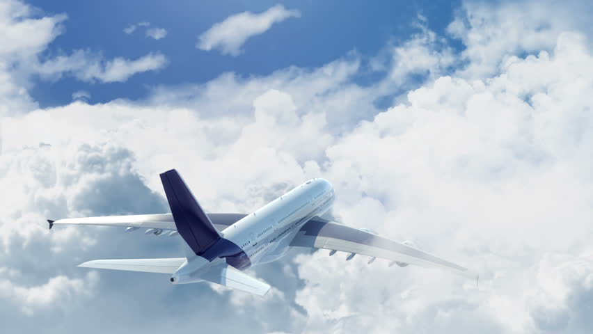camera chasing a commercial airplane flying above the clouds