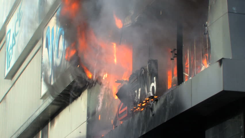 BANGKOK, THAILAND - APRIL 19: Zen Central Department Store engulfed in smoke and flames during "Red Shirt" violent protest riots on April 19, 2010 in Bangkok, Thailand