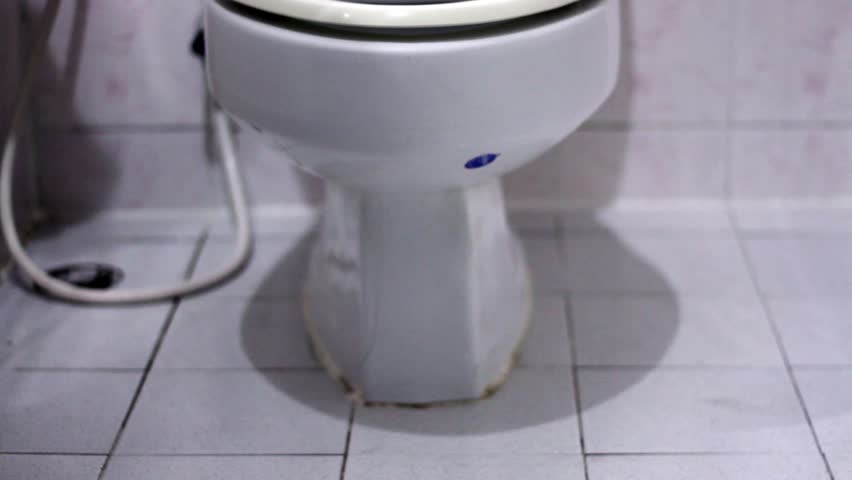 man defecate on toilet