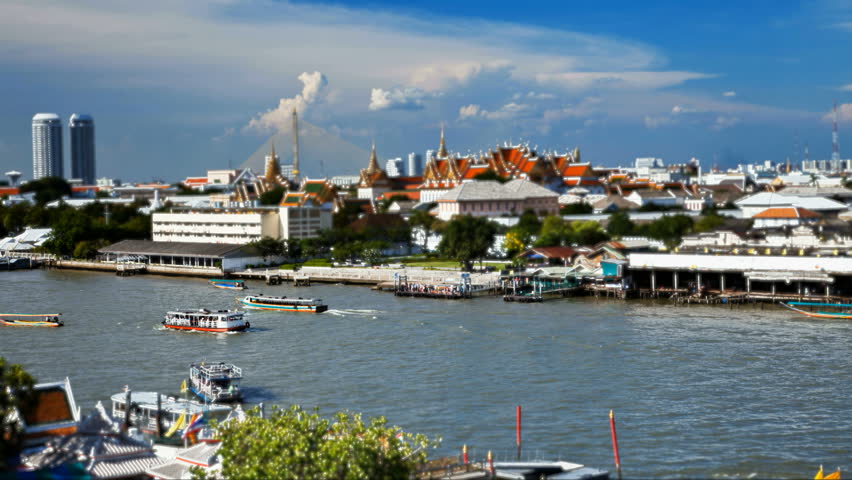 Tilt-shift Timelapse - View of Chao Phraya river from Wat Arun in Bangkok, Thailand. Grand Palace Seen in the background