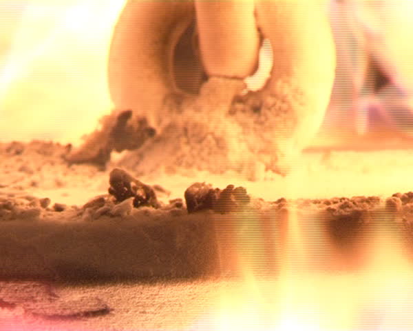 closeup of burning straw pellets in boiler. flames and fire details. ecologic fuel use for house heating.