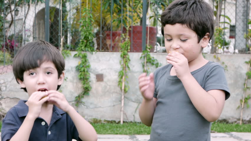 Boys Share Twinky Cake (HD). Two brothers of Hispanic origin; six and four years old share and eat a twinky cake. Note: The younger Brother on the left suffers from a slight Lazy eye problem.