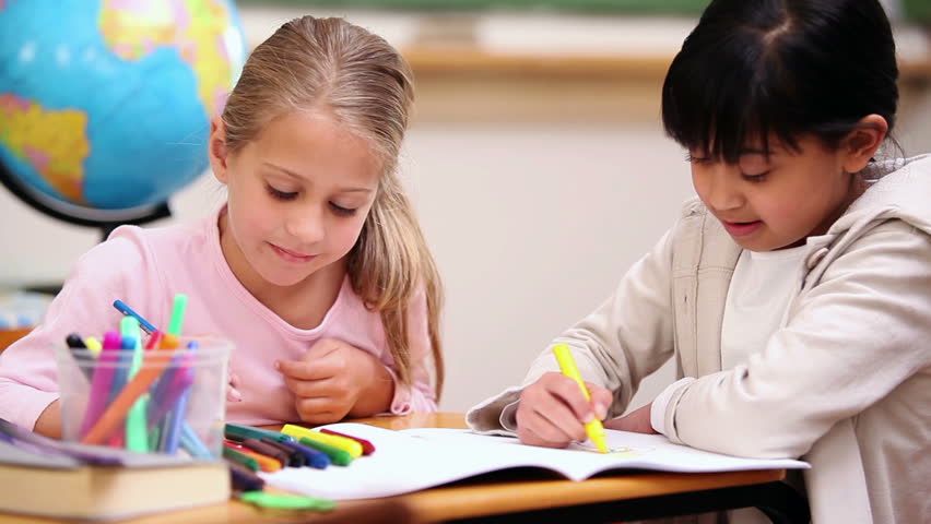 Classmates coloring in the classroom