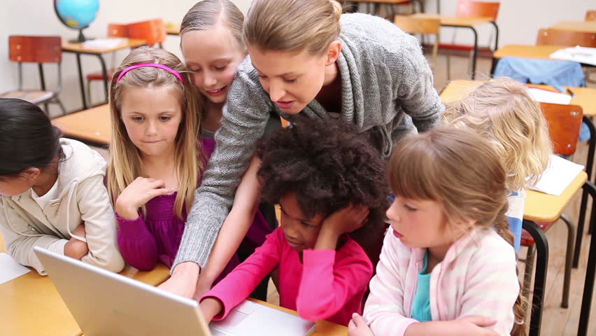 Teacher using a laptop in the classroom