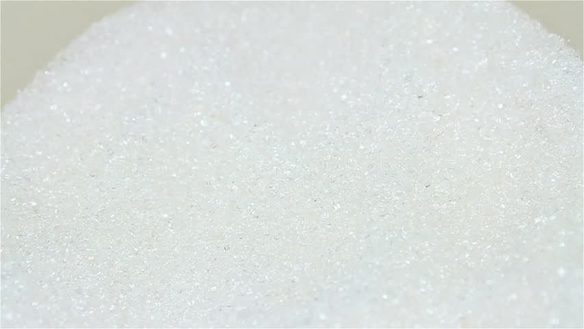 Scooping sugar with spoon