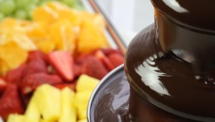 Flowing chocolate in chocolate fountain detail