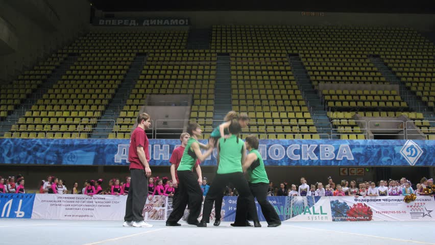 MOSCOW - MAR 24: (Timelapse View) Teams of gymnasts participate in participates in Annual competitions of Championship of Moscow on cheerleading in Dynamo sports palace, on March 24, 2012 in Moscow