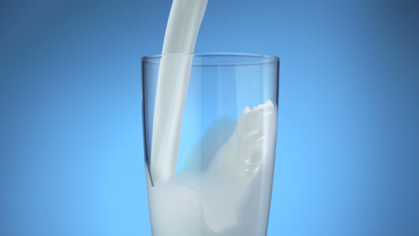 Milk pouring into glass shooting with high speed camera, phantom flex.