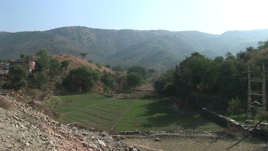 Farmer's fields and rugged Rajahstan mountains,rural Rajasthan near Jaipur, India