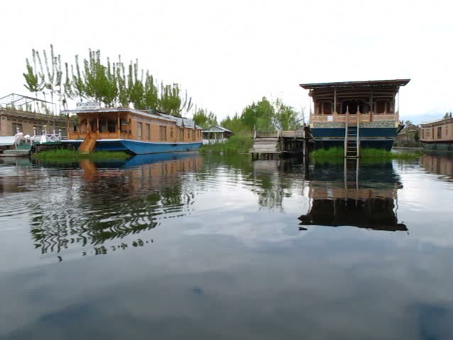 SRINAGAR, INDIA - APRIL 14: Tourists take a boat around the lake on April 14, 2012 in Dal Lake, Srinagar, Jammu and Kashmir, India.