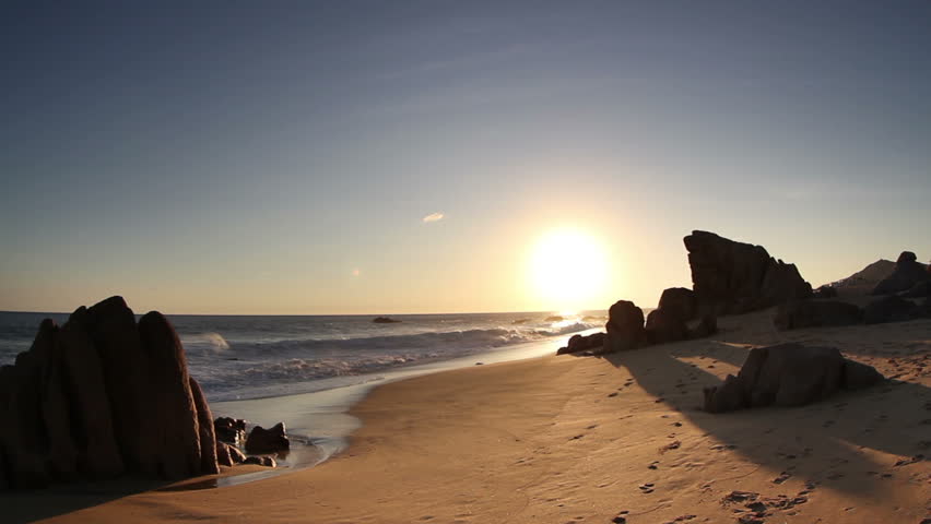 beautiful timelapse shot at sunset in los cabo, baja california sur mexico where the desert reaches right down to the pacific ocean. there is an amazing quality of light around this area