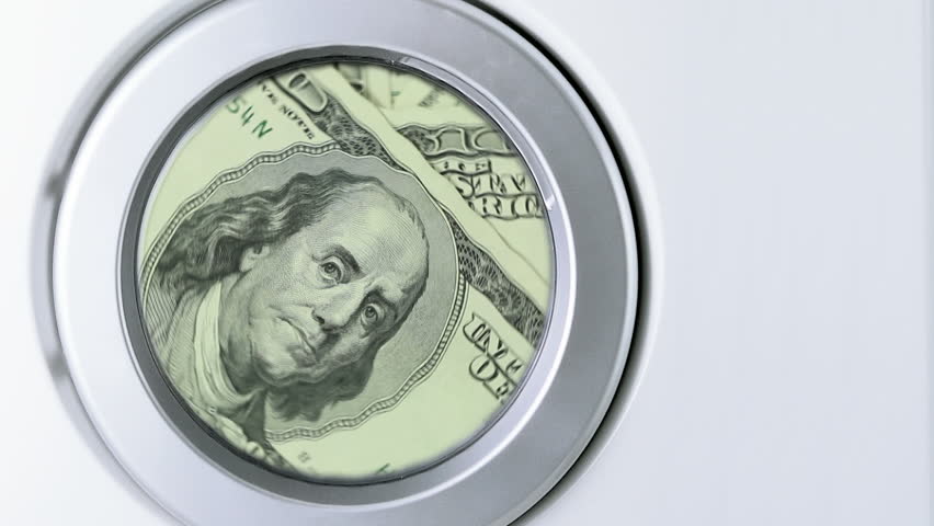 Money Laundering Concept, One hundred dollar bills in a laundry, space for copy on the right.