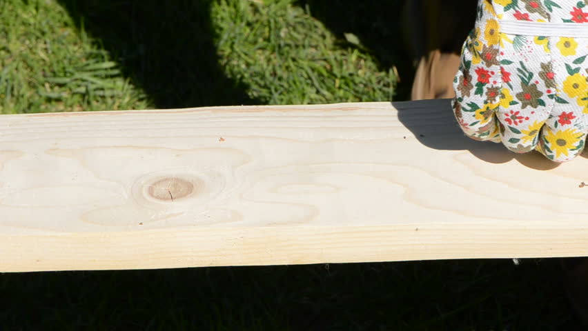 carpentry measure wood plank and marking it with pencil