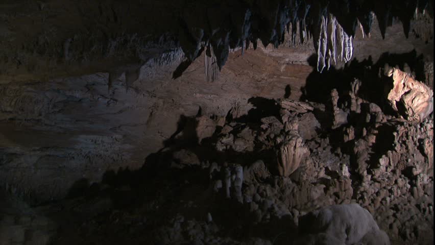 Pan from stalactites to cave room