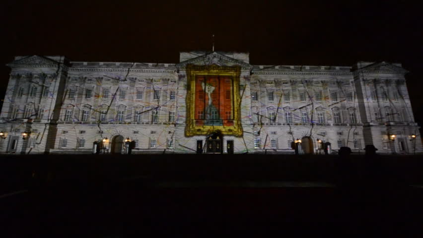 LONDON - APRIL 21: Buckingham Palace projection shows the portrait of Queen Elizabeth, self-portraits of young people and other images in the art project Face Britain on April 21, 2012 in London, UK.