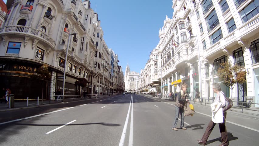 MADRID - MAR 11: (Timelapse View) Bus go on Gran Via Street along walking tourists, on Mar 11, 2012 in Madrid, Spain